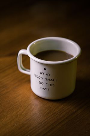 A coffee cup with the words - what good shall i do this day?