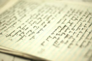 An open notebook filled with writing