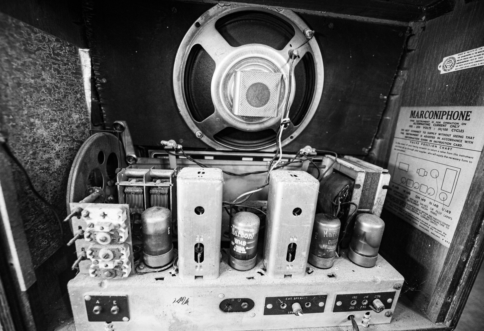 black and white photo of the inside of an old radio
