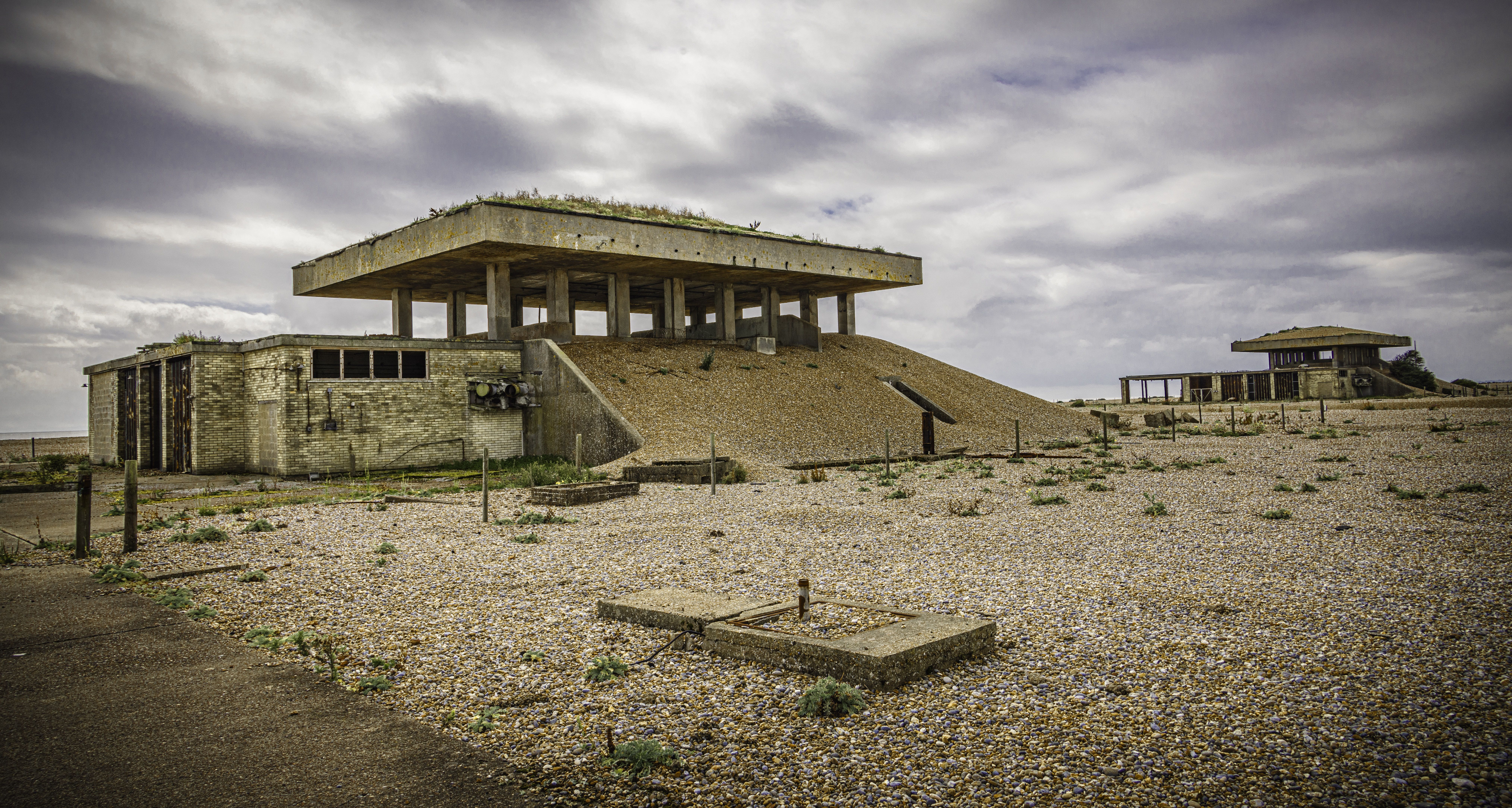 a big concrete structure, building in a desolate landscape